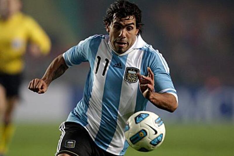 Carlos Tevez, pictured here playing for Argentina in their Copa America draw with Bolivia at the weekend, cites family reasons for wanting away from Manchester City.