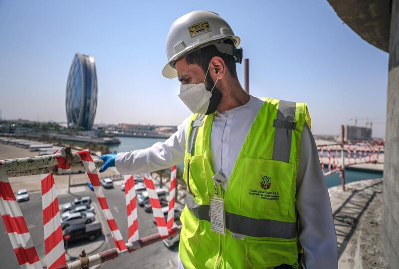 Abu Dhabi, United Arab Emirates, September 27, 2020.  Saif Abdul Hay from the Abu Dhabi City Municipality inspects safety standards of a construction site at the Al Raha Gardens, Abu Dhabi.
Victor Besa/The National
Section:  NA
Reporter:  Haneen Dajani