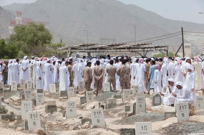 FUJEIRAH, UNITED ARAB EMIRATES, 19 JUNE 2017. The funeral of Emirati Athlete Abdullah Hayayei in Qidfa that died from an accident in London while training. Family and commmunity members gather at the cemetery in Qidfa to lay Abdullah to rest. (Photo: Antonie Robertson/The National) Journalist: Ruba Haza. Section: National.