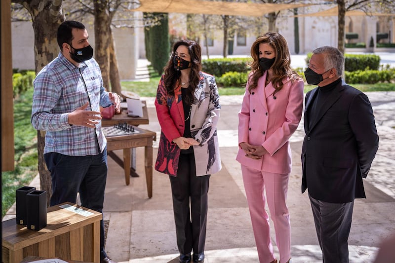 King Abdullah II, accompanied by Queen Rania Al Abdullah, views sample products from beneficiaries of the Productive Youth Initiative. Courtesy Royal Hashemite Court