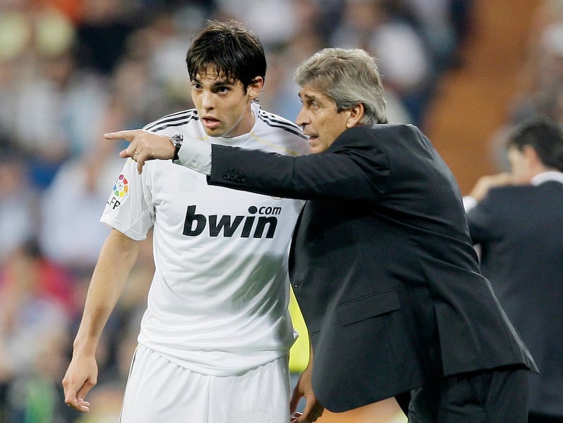 Real Madrid's coach Manuel Pellegrini of Chile, right, gives instructions to Kaka of Brazil during a Spanish La Liga soccer match against Getafe at the Santiago Bernabeu stadium in Madrid, Saturday Oct. 31, 2009.  (AP Photo/Paul White)