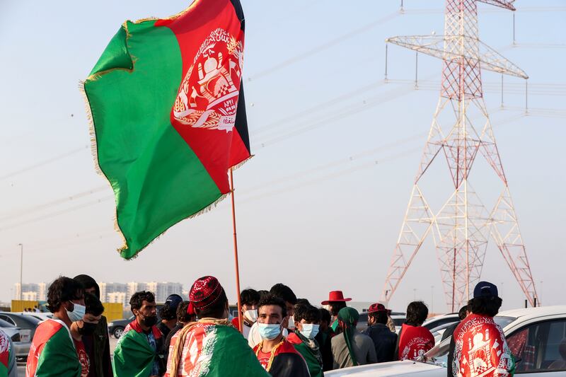 Afghanistan fans outside Zayed Cricket Stadium to support their cricket team. Khushnum Bhandar i/ The National