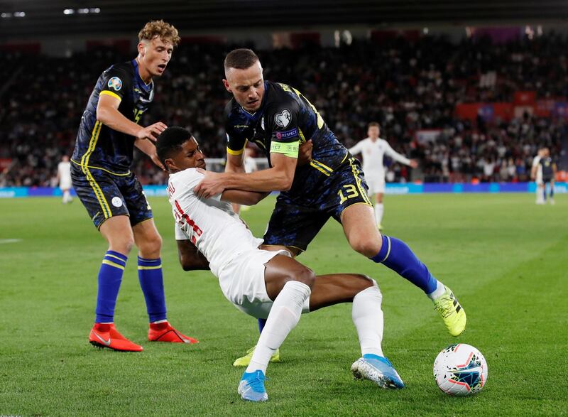 England's Marcus Rashford in action with Kosovo's Amir Rrahmani. Reuters