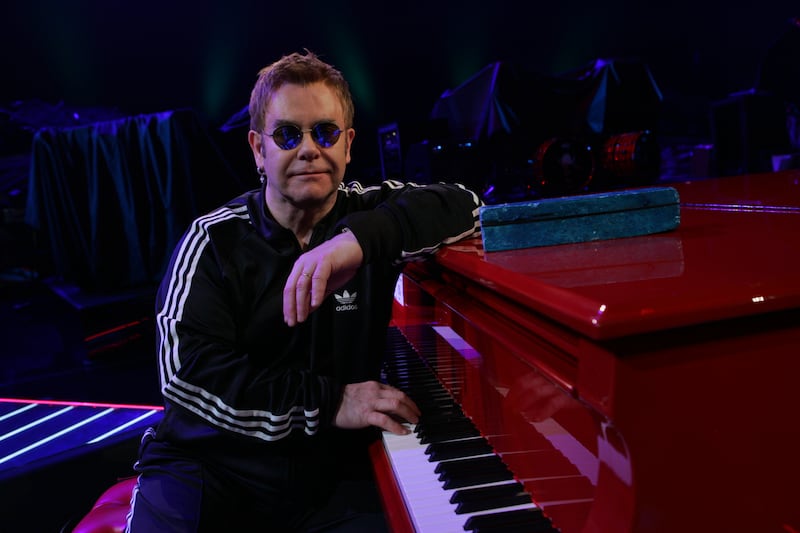 Elton John, wearing a black Adidas tracksuit, records his contribution to disaster relief charity single 'Tears In Heaven' at Caesars Palace, Las Vegas on April 10, 2005. Getty Images