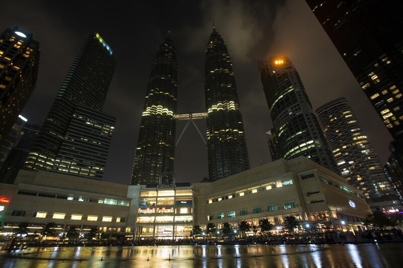 Malaysia's landmark Petronas Twin Towers and surroundings with lights turned off to mark Earth Hour in Kuala Lumpur. EPA