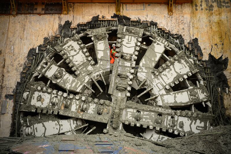 Engineers wave through gaps in the drill face after a boring machine broke through to complete HS2's longest tunnel, in Great Missenden, England. The high-speed rail line will run between London and Birmingham. Getty Images