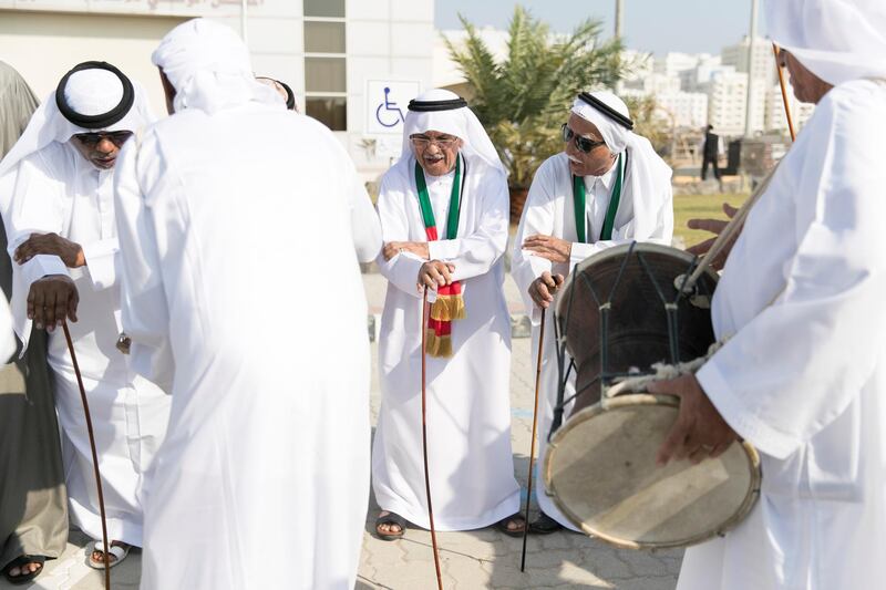 FUJAIRAH, UNITED ARAB EMIRATES - NOV 28:

A musical band dances outside the National Media Council offices in Fujairah as part of the UAE National Day celebrations.

Al Fujairah began it's UAE National Day celebrations with a national parade.

(Photo by Reem Mohammed/The National)

Reporter:  Ruba Haza
Section: NA