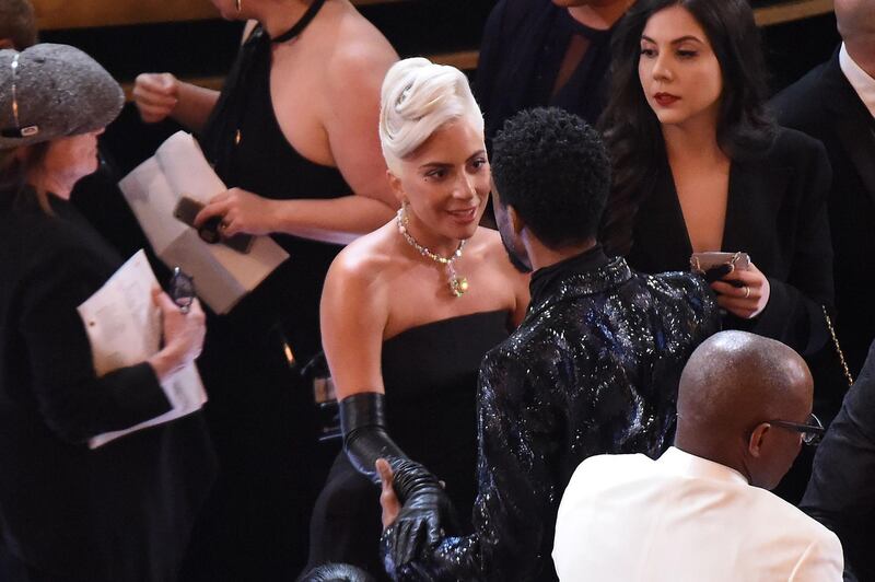 Singer and actress Lady Gaga and US actor Chadwick Boseman chat during the 91st Annual Academy Awards at the Dolby Theatre in Hollywood, California. Photo: AFP
