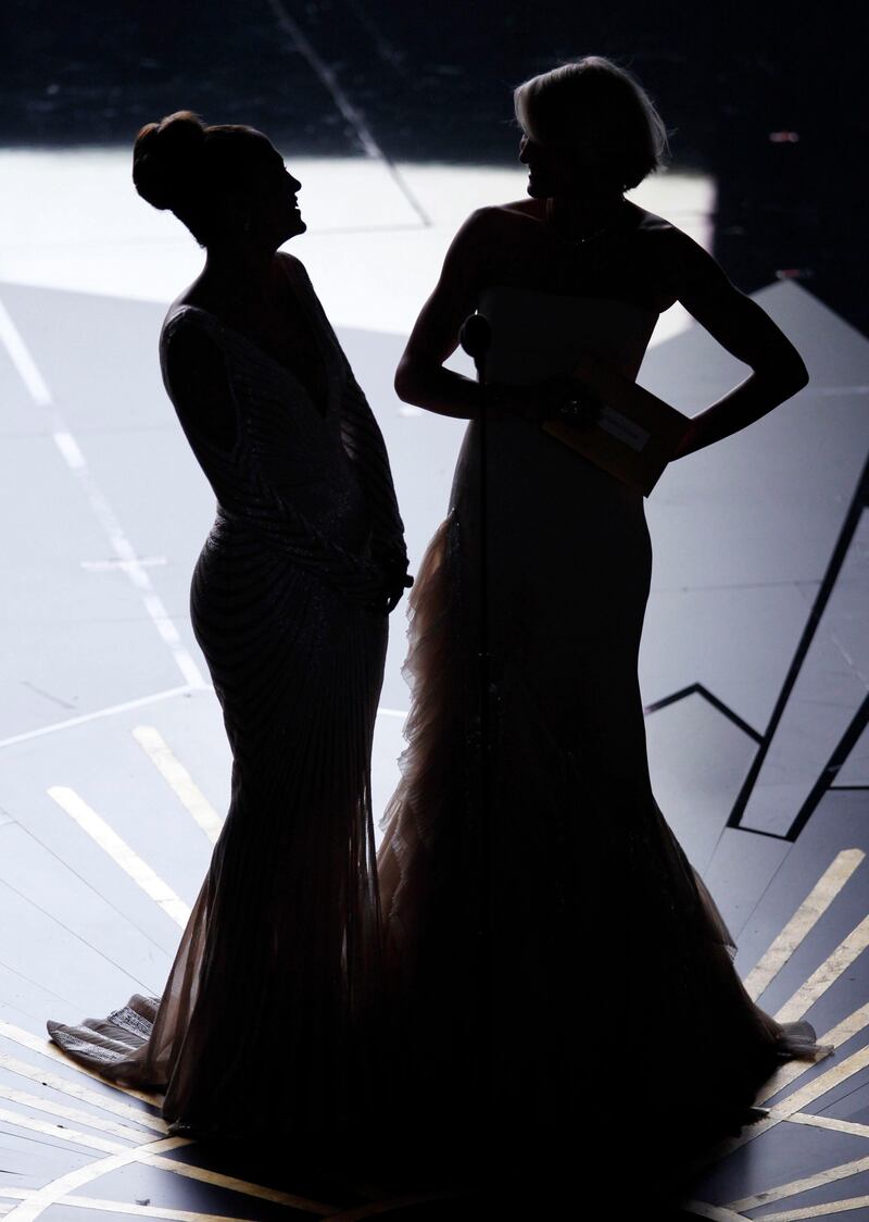 Presenters Cameron Diaz (R) and Jennifer Lopez stand on stage as they present awards at the 84th Academy Awards in Hollywood, California, February 26, 2012.  REUTERS/Gary Hershorn (UNITED STATES - Tags: ENTERTAINMENT) (OSCARS-SHOW)