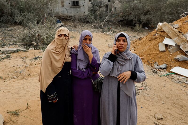 Palestinian women at the site of an Israeli strike in Khan Younis in the southern Gaza Strip. Reuters