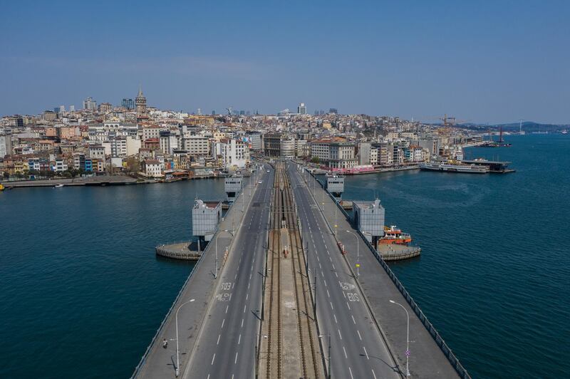 Galata Bridge is empty during a two-day lockdown imposed to prevent the spread of coronavirus in Istanbul, Turkey. Getty Images