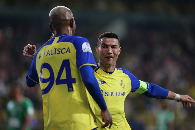 Cristiano Ronaldo celebrates with Anderson Talisca. Reuters