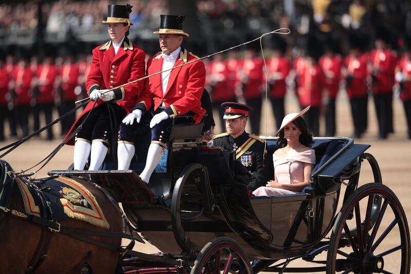 Prince Harry, Duke of Sussex and Meghan, Duchess of Sussex arrive at Horse Guards Parade in 2018