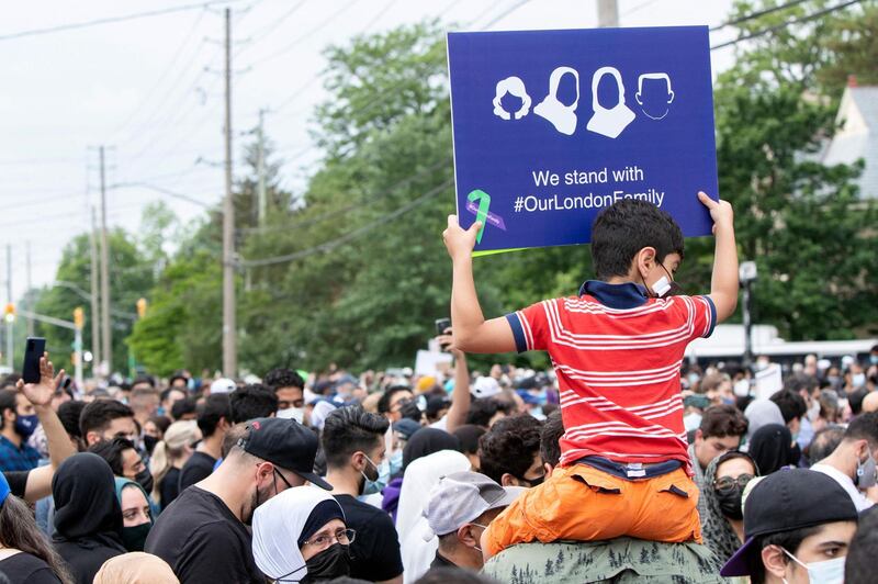 Londoner's attend a vigil for the victims of the deadly vehicle attack on five members of the Canadian Muslim community in London, Ontario, Canada, June 8, 2021. Canadian Prime Minister Justin Trudeau on Tuesday labeled as a "terrorist attack" the killing of four members of a Muslim family, who were run down by a man driving a pick-up truck. "This killing was no accident. This was a terrorist attack, motivated by hatred, in the heart of one of our communities," Trudeau said during a speech at the House of Commons. The suspect, identified as Nathaniel Veltman, 20, was arrested shortly after the June 6 attack, has been charged with four counts of first-degree murder and one count of attempted murder. / AFP / Nicole OSBORNE
