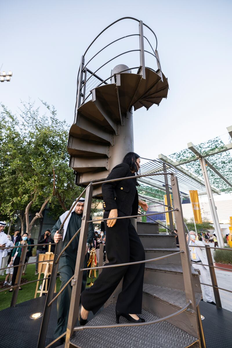 Nathalie Kennedy, France's consul-general in Dubai, leads the way up the steps of the Eiffel Tower at Al Forsan Park, Expo 2020 Dubai. Photo: Anthony Fleyhan / Expo 2020 Dubai