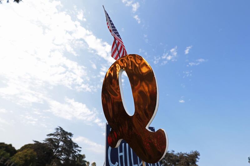 A QAnon sign is seen at a rally in Beverly Hills, California, August 22, 2020. The rally was part of a weekly gathering of pro-Trump demonstrators supporting the police and denouncing the Black Lives Matter movement.  EPA