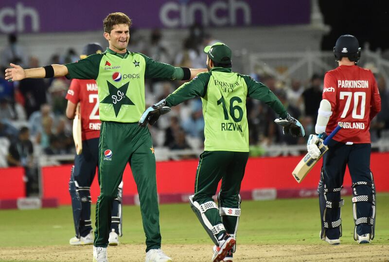 Pakistan's Shaheen Shah Afridi, left, celebrates with wicketkeeper Mohammad Rizwan the dismissal of England's Matt Parkinson, right, to win the first T20 in Nottingham on July 16, 2021.