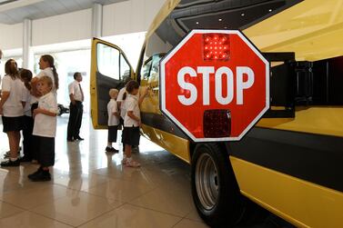 School bus drivers are being warned they must use their vehicles’ stop signs when collecting or dropping off pupils. Pawan Singh / The National