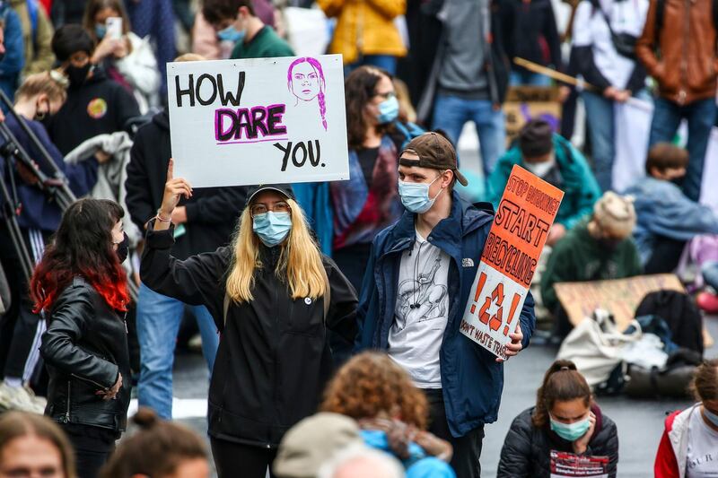 A protester holds a banner depicting Greta Thunberg in Berlin, Germany. Getty Images