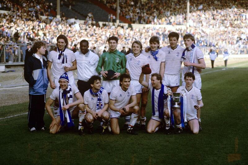 Chelsea celebrate with the Full Members Cup after their 5-4 victory: (back row, l-r) Micky Hazard, Colin Lee, Keith Dublin, Steve Francis, John Bumstead, Colin Pates, Joey McLaughlin, Nigel Spackman; (front row, l-r) Doug Rougvie, Pat Nevin, Darren Wood, David Speedie, Kevin McAllister  (Photo by S&G/PA Images via Getty Images)