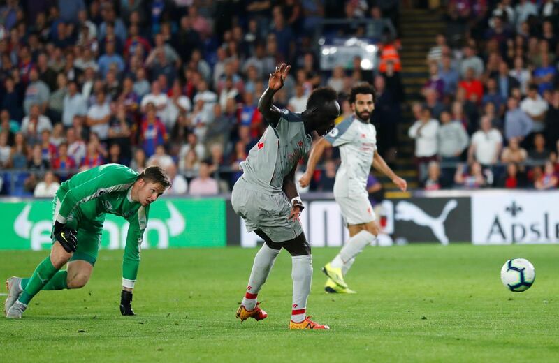 Sadio Mane goes round Wayne Hennessey to score Liverpool's second goal. Reuters