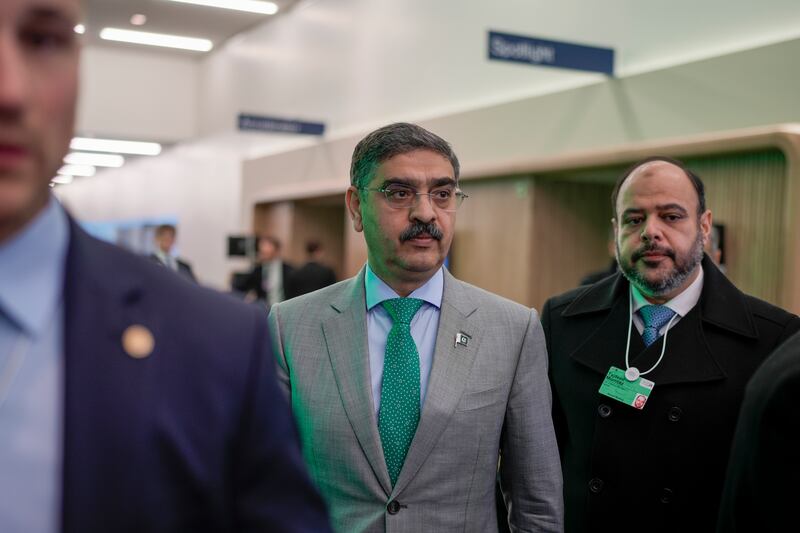 Pakistan's caretaker prime minister Anwar ul-Haq, centre, after his speech at the annual meeting of the World Economic Forum in Davos, Switzerland. AP