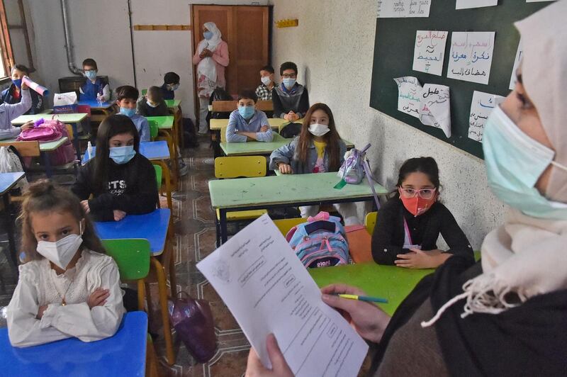 Students sit in a classroom on the first day of school following the resumption of classes in the Algerian capital Algiers.  AFP