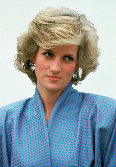 ITALY - APRIL 22:  Diana, Princess Of Wales, Wearing A Silk Suit Designed By Fashion Designer Bruce Oldfield, During An Official Overseas Visit. Diana's Crystal Heart Earrings Are By Jewellers Butler And Wilson.  (Photo by Tim Graham/Getty Images)