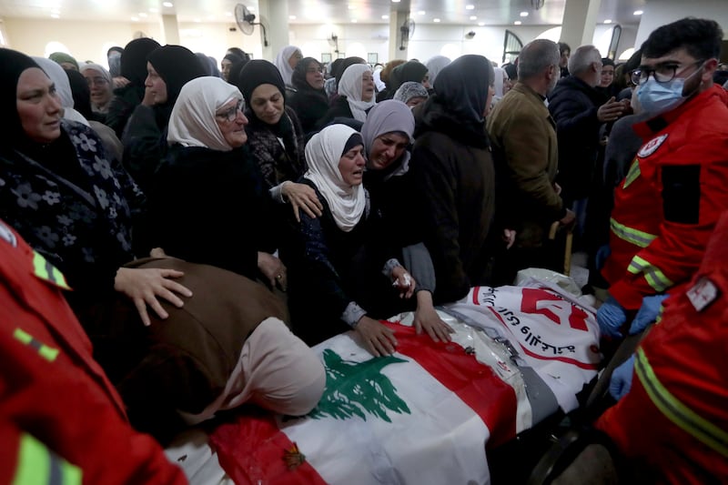One of the coffins is draped in the Lebanese flag. AP Photo