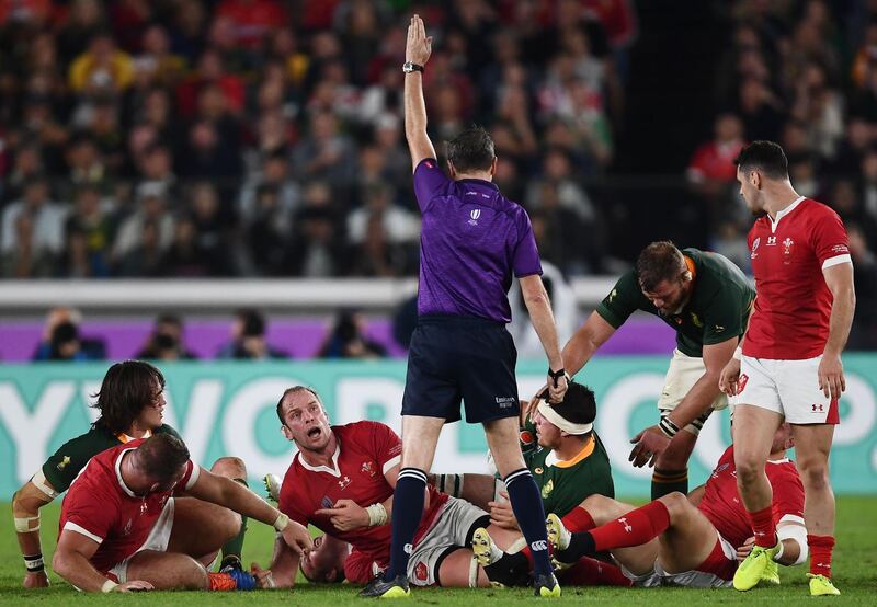 Wales' lock Alun Wyn Jones (3rd L) looks at referee Jerome Garces during the Japan 2019 Rugby World Cup semi-final match between Wales and South Africa at the International Stadium Yokohama in Yokohama.  AFP