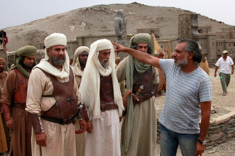 Hatem Ali speaks with actors during the making of the series 'Omar' in Morocco in 2011. EPA
