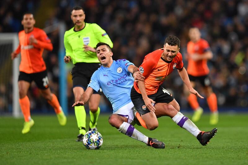 Manchester City's Spanish midfielder Rodri and Shakhtar Donetsk's Ukrainian forward Junior Moraes. AFP