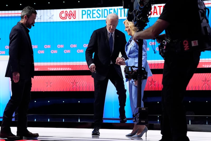 President Joe Biden walks off stage at the end of the first presidential debate with Donald Trump in Atlanta, Georgia, followed by first lady Jill Biden. AP