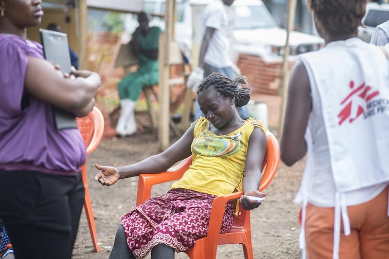 A woman in Guinea grieves for her younger sister, who died two days after being diagnosed with Ebola. Sylvain Cherkaoui / Cosmos