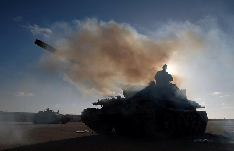 FILE PHOTO: Members of Libyan National Army (LNA) commanded by Khalifa Haftar, get ready before heading out of Benghazi to reinforce the troops advancing to Tripoli, in Benghazi, Libya April 13, 2019. REUTERS/Esam Omran Al-Fetori/File Photo