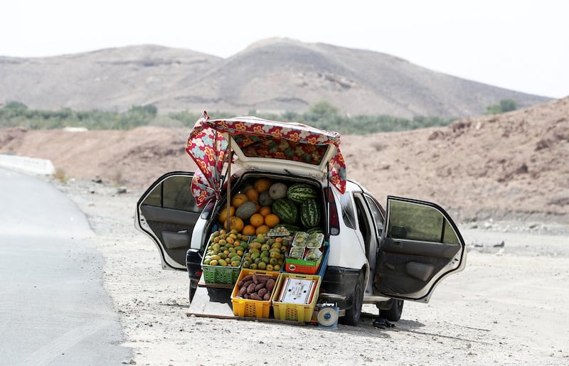 SHARJAH, UNITED ARAB EMIRATES , August 27 – 2020 :- Fruits displayed in the car by fruit seller on Khorfakkan road in Sharjah.  (Pawan Singh / The National) For Standalone/Stock/Instagram/Big Picture