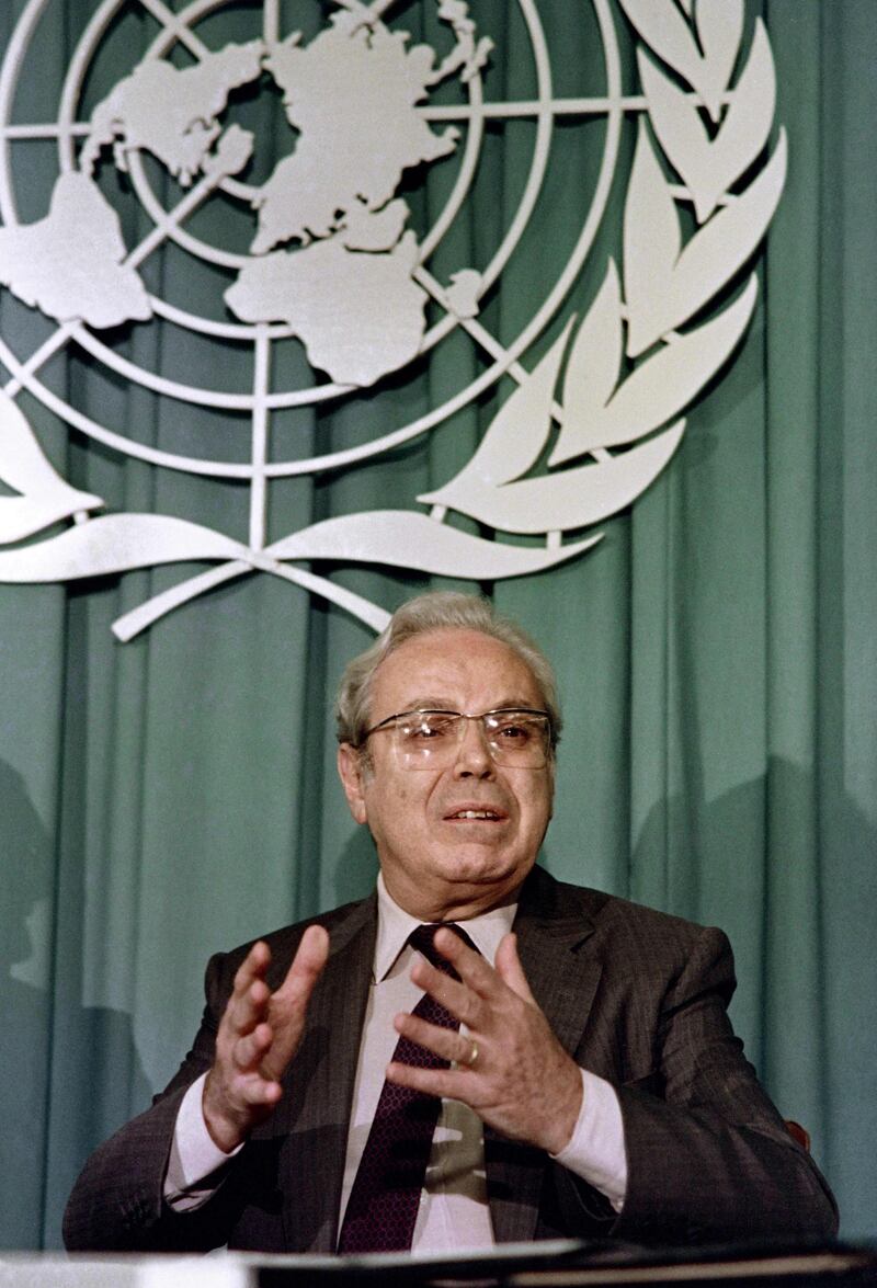 Mr de Cuellar at a news conference in 1998 announcing that Iran had unconditionally agreed to a ceasefire in the almost-eight-year Iran-Iraq war. AFP