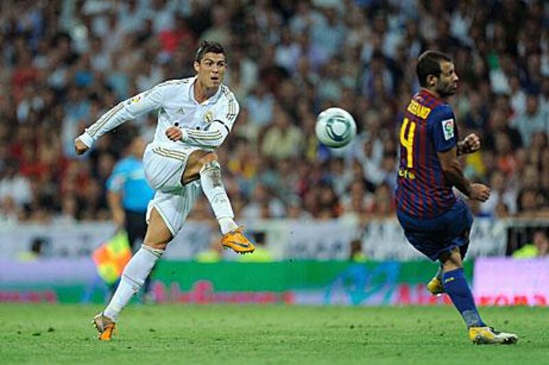 Cristiano Ronaldo, left, shoots on goal during Real Madrid's 2-2 Super Cup first-leg draw with Barcelona at the Bernabeu.