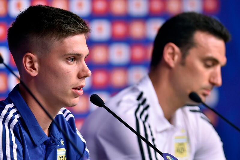 Argentina defender Juan Foyth, left, manager Lionel Scaloni attend a press conference. AFP