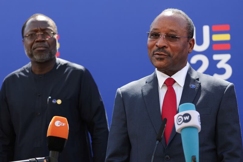 Ecowas President Omar Alieu Touray looks on as Minister of Foreign Affairs of Niger Hassoumi Massaoudou speaks to the media following an EU foreign ministers meeting in Toledo, Spain. Reuters