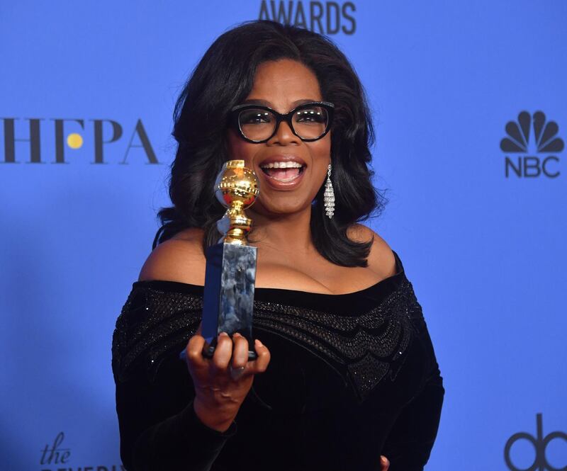 Actress and TV talk show host Oprah Winfrey poses with the Cecil B. DeMille Award during the 75th Golden Globe Awards on January 7, 2018, in Beverly Hills, California. / AFP PHOTO / Frederic J. BROWN