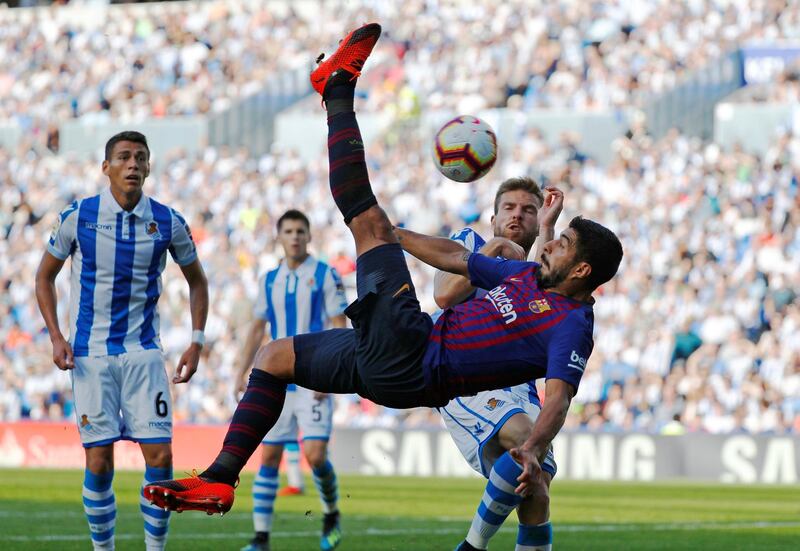 Barcelona's Luis Suarez with an acrobatic shot at goal. Reuters