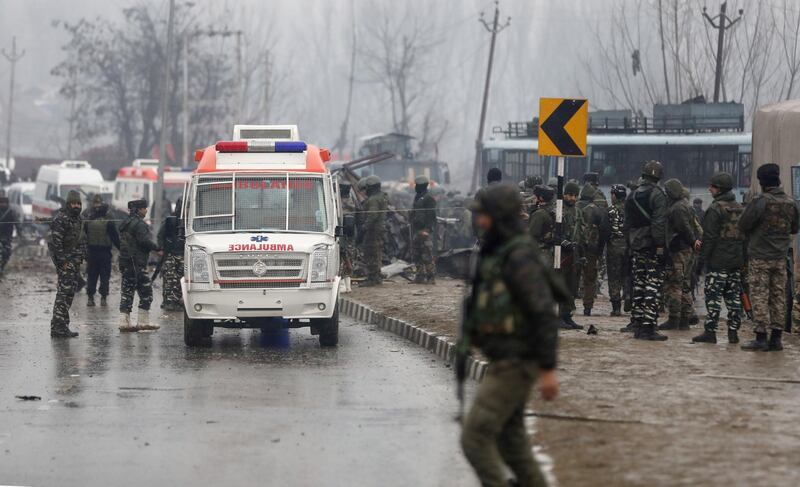 Indian security officers stand guard near the site blast in Lethpora area of  south Kashmir' s Pulwama  district some 20 kilometers from Srinagar, the summer capital of Indian Kashmir.  EPA