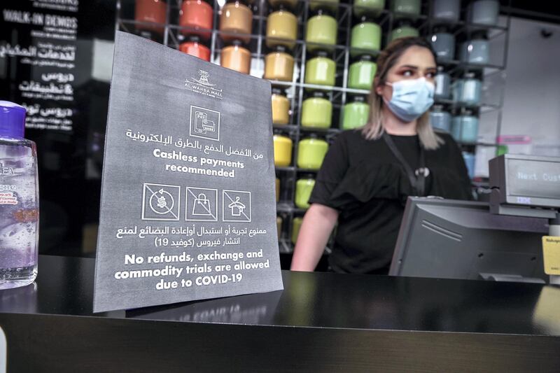 Abu Dhabi, United Arab Emirates, May 10, 2020.  
 The reopening of the Al Wahda Mall during the Coronavirus pandemic.  A "Cash payments recommended" sign at MAC.
Victor Besa/The National
Section:  NA
Reporter: