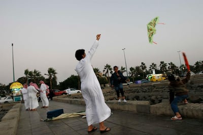A man flies a kite in Jiddah, Saudi Arabia, Tuesday, Dec. 26, 2007. (AP Photo/Hasan Sarbakhshian)