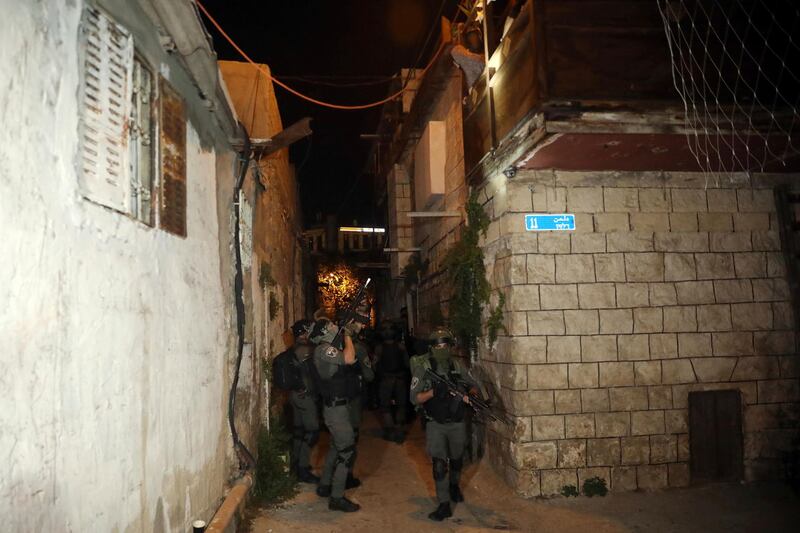 Elite Israeli forces conduct a search in Sheikh Jarrah, East Jerusalem, after clashes between police and Palestinian protesters nearby on Friday, May 7, 2021. AP