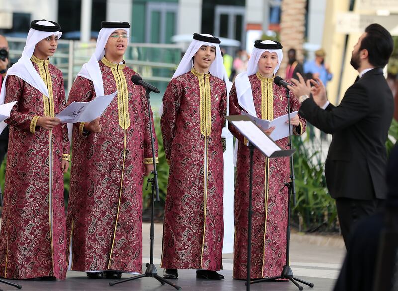 Children perform during Qatar Day at Expo 2020 Dubai