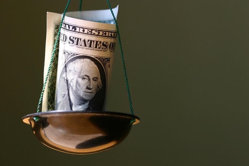 Dollar in a bowl of balance.