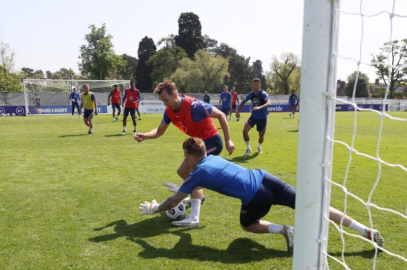 MIDDLESBROUGH, ENGLAND - JUNE 01: Harry Kane of England controls the ball under pressure from Jordan Pickford during a training session at an England Pre-Euro 2020 Training Camp on June 01, 2021 in Middlesbrough, England. (Photo by Eddie Keogh - The FA/The FA via Getty Images)