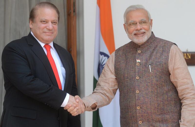 Narendra Modi, right, with Nawaz Sharif in New Delhi  last year. Raveendran / AFP